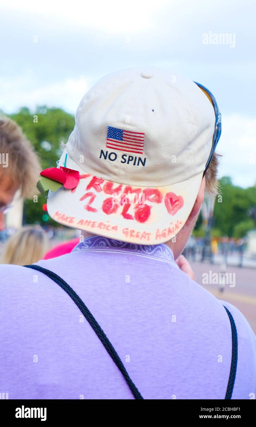 A Donald Trump supporter sports a customised MAGA baseball cap during a demonstration against his UK state visit in June 2019. Stock Photo
