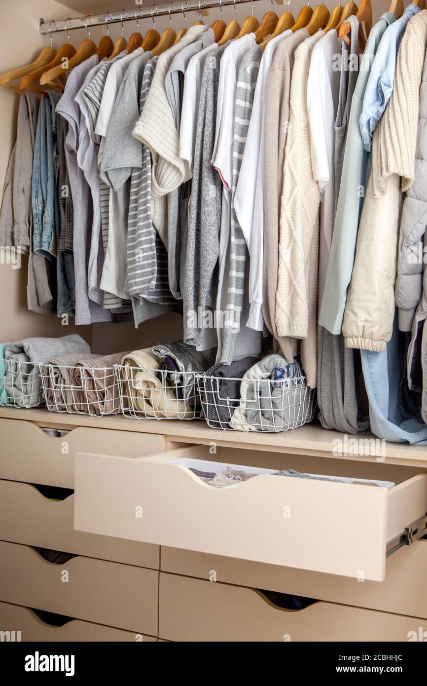 Wardrobe with perfect order clothes shades. Storage clothes Stock Photo