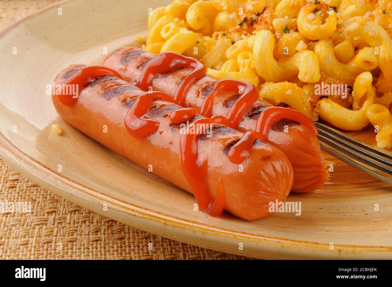 Close up of grilled hot dogs with catsup Stock Photo Alamy