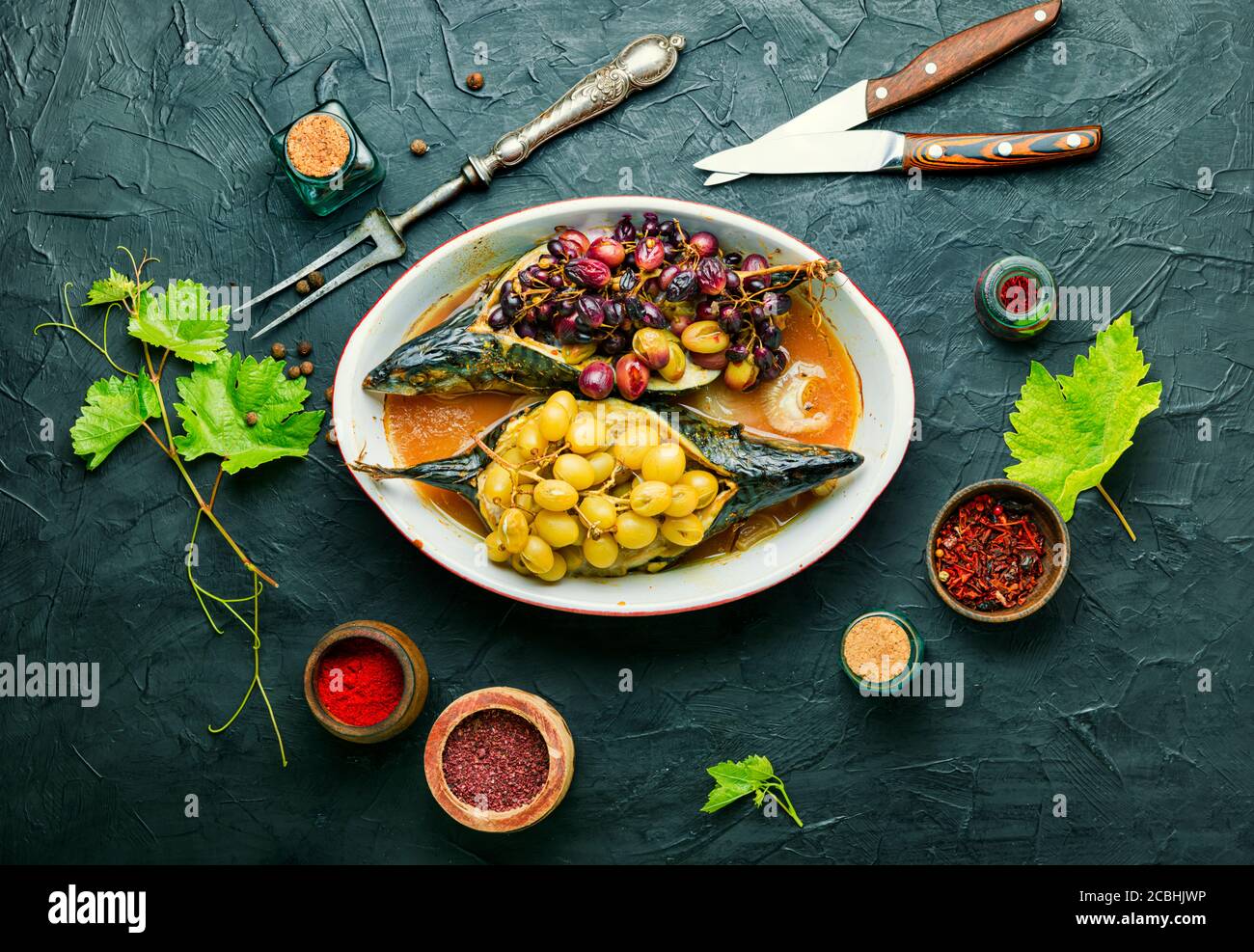 Baked mackerel or scomber in grape berry sauce.Fish food Stock Photo ...