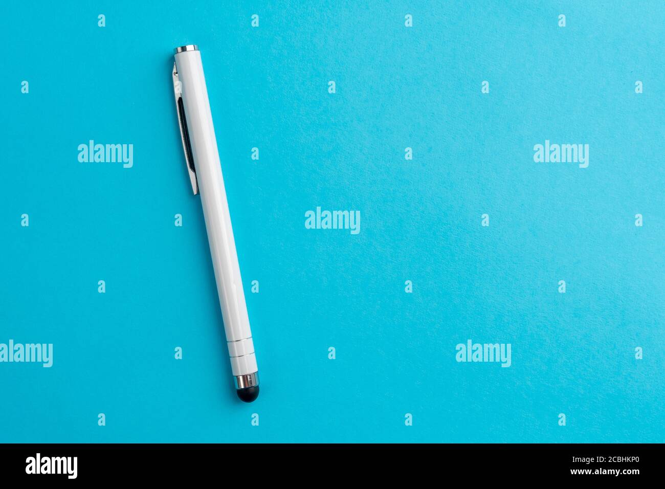 Capacitive touchscreen stylus on blue background. Copyspace. Closeup Stock Photo