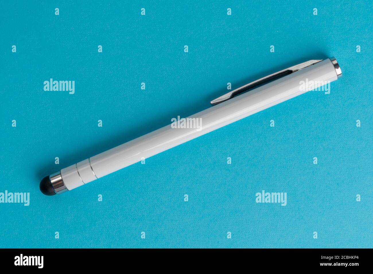 Capacitive touchscreen stylus on blue background. Closeup Stock Photo