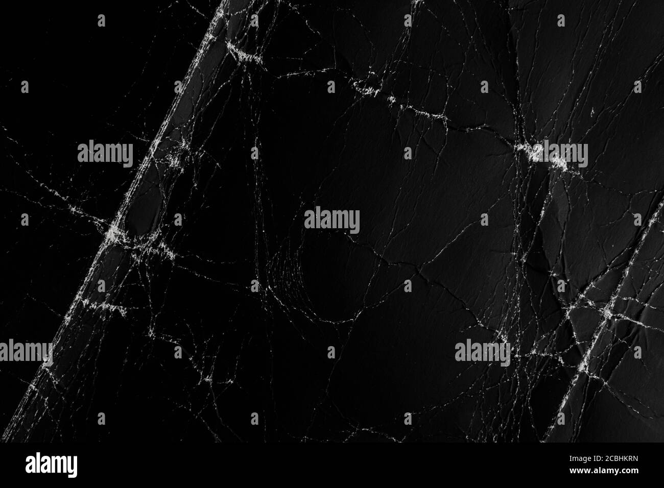 Black paper background. Old and crumpled Stock Photo