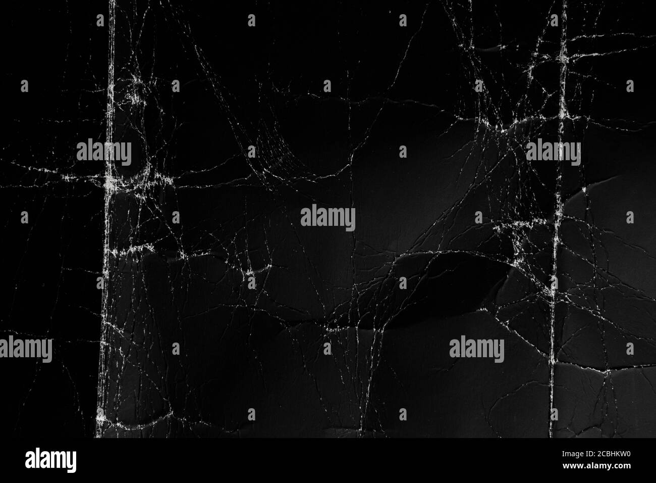 Black paper background. Old and crumpled Stock Photo