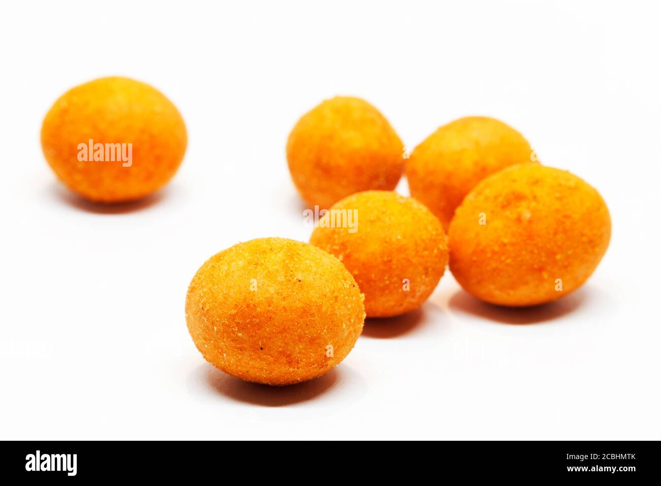 roasted chili nuts on white background Stock Photo