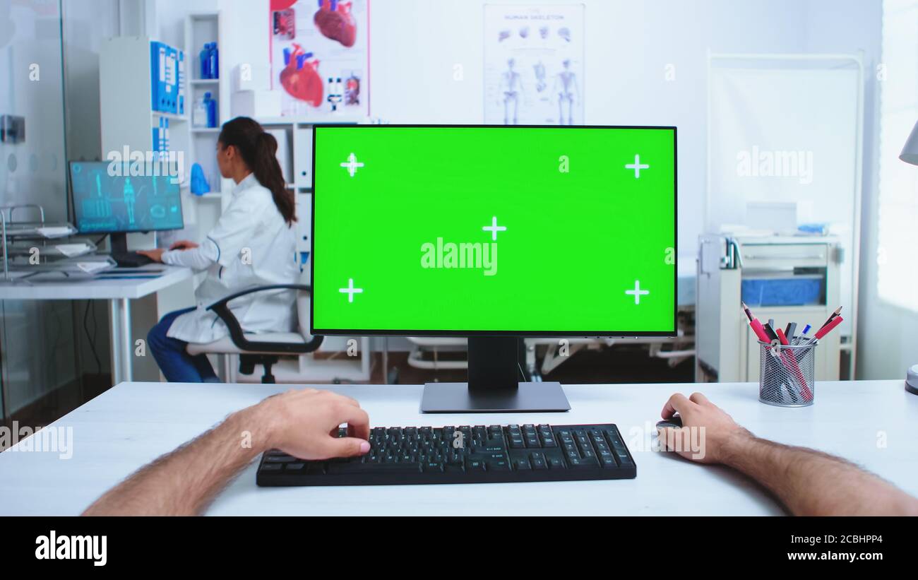 Pov of medical practitioner using computer with copy space available in