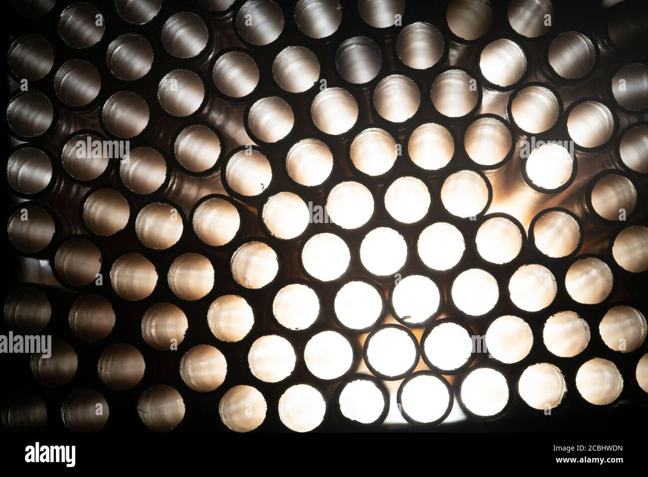 Industrial texture created using paper straws, playing with light Stock Photo