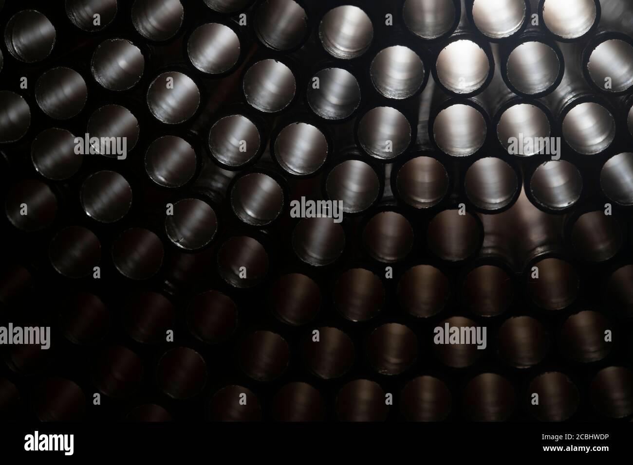 Industrial texture created using paper straws, playing with light Stock Photo