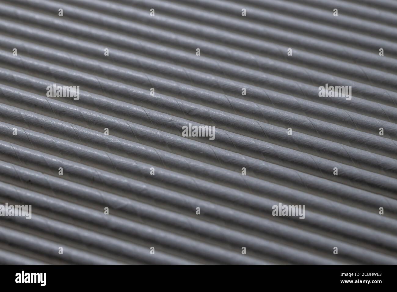 Industrial texture created using paper straws, playing with light Stock Photo