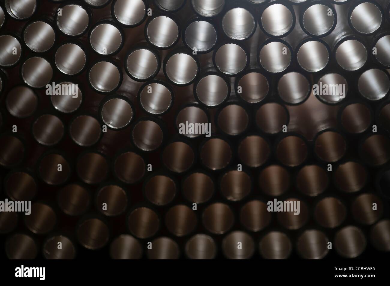Industrial texture created using paper straws, playing with light Stock Photo