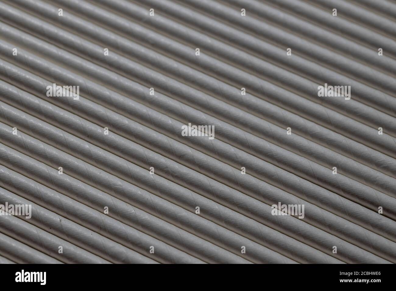 Industrial texture created using paper straws, playing with light Stock Photo