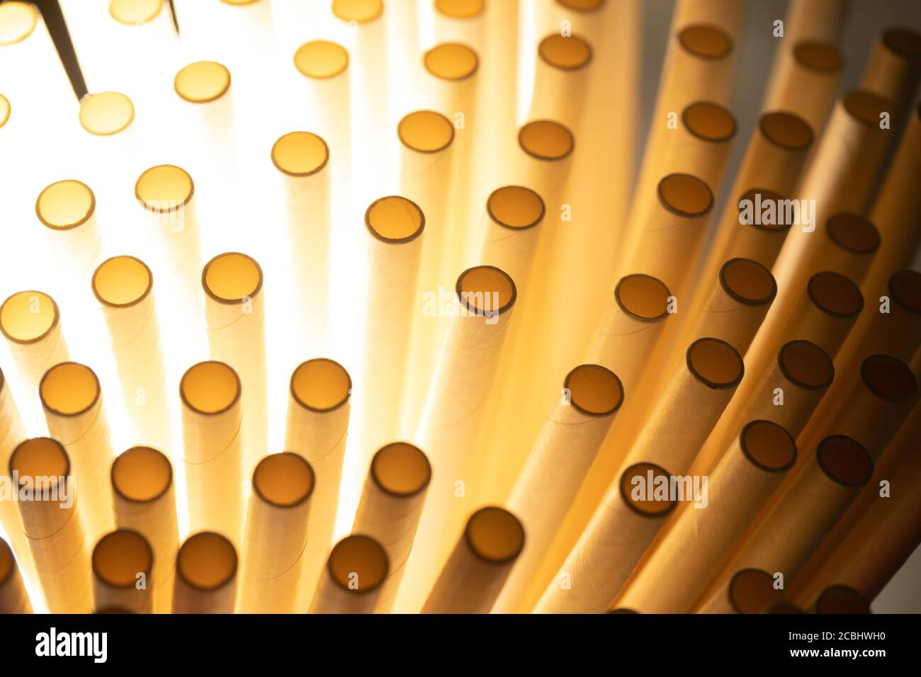 Industrial texture created using paper straws, playing with light Stock Photo