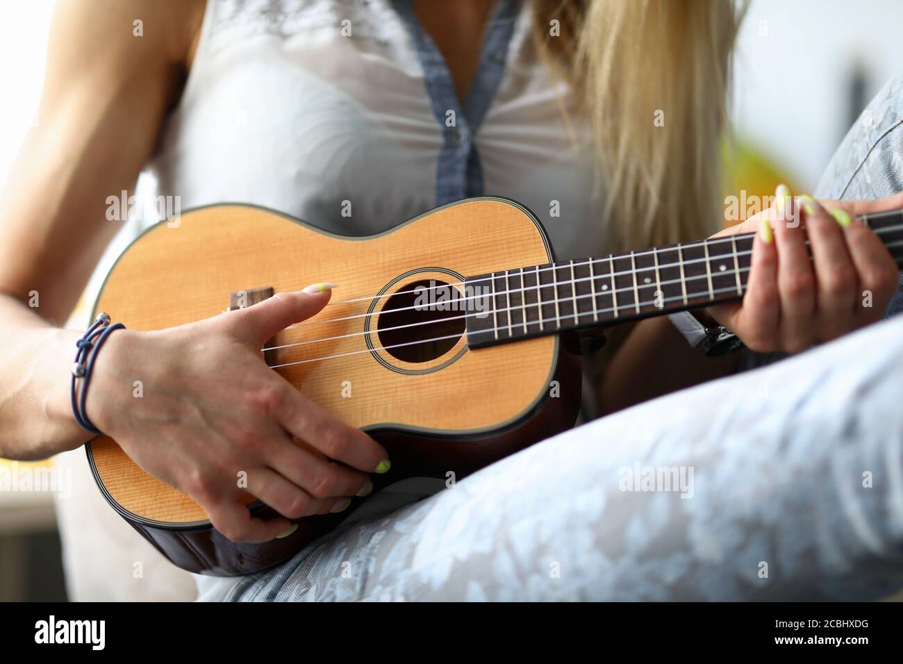 Holding a sale ukulele