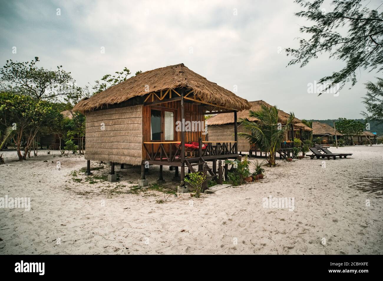 cheap budget accommodation on the beach, bamboo huts Stock Photo