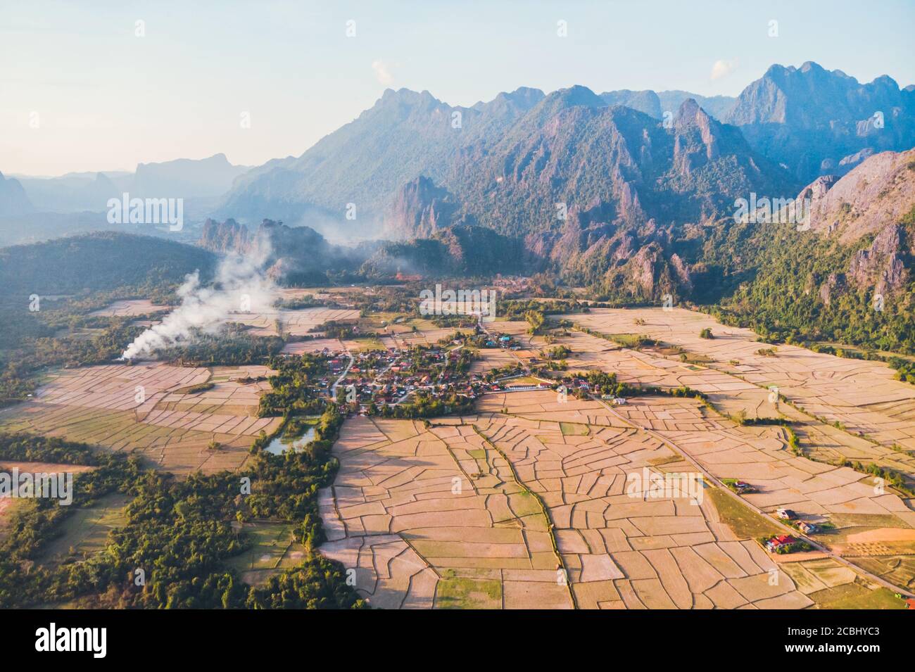 Nature image of Vang Vieng. a famous Landscape in Vang Vieng, Vientiane Province, Beautiful view from the air to the rice fields among the mountains. Stock Photo