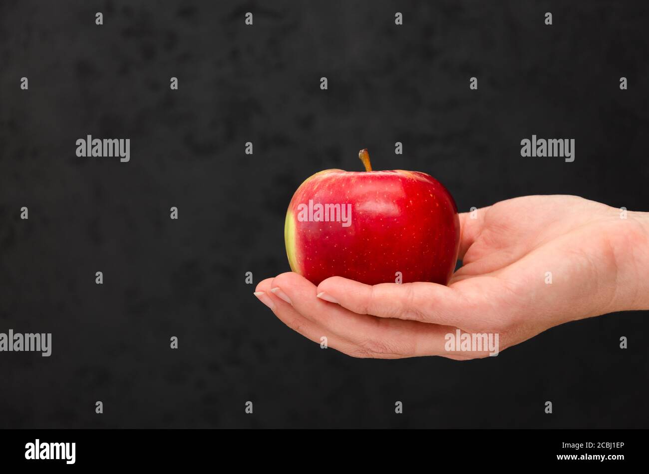 Womans hand holding apple hi-res stock photography and images - Alamy