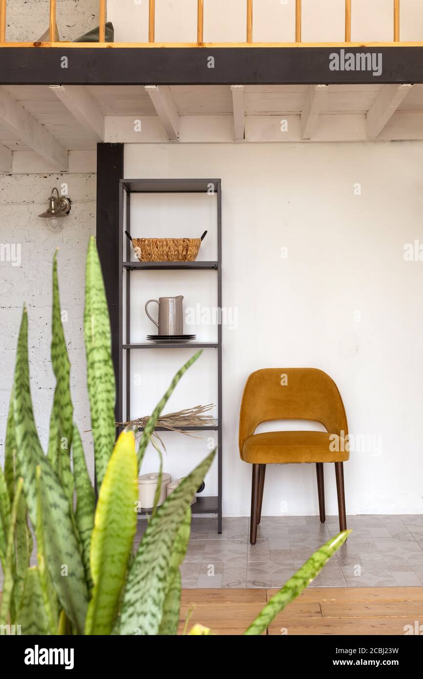 Chair and shelves in stylish loft Stock Photo