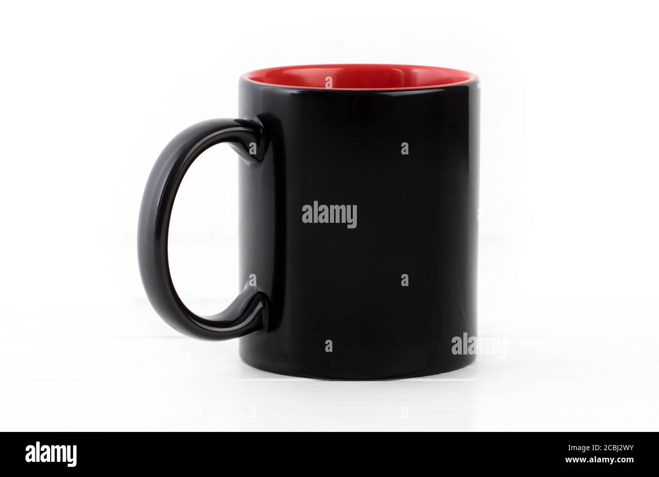 Blank black cup with red isolated on white background Stock Photo
