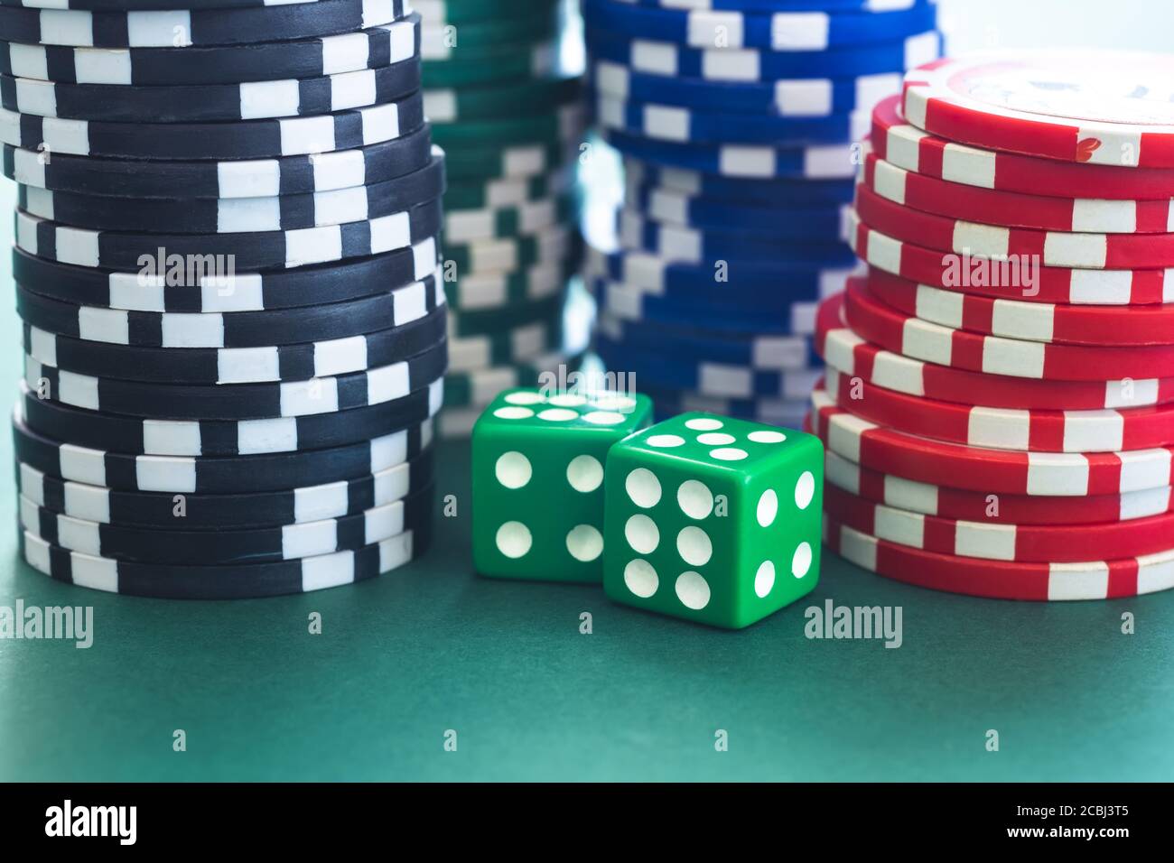 Playing dice and poker chips stacks Stock Photo