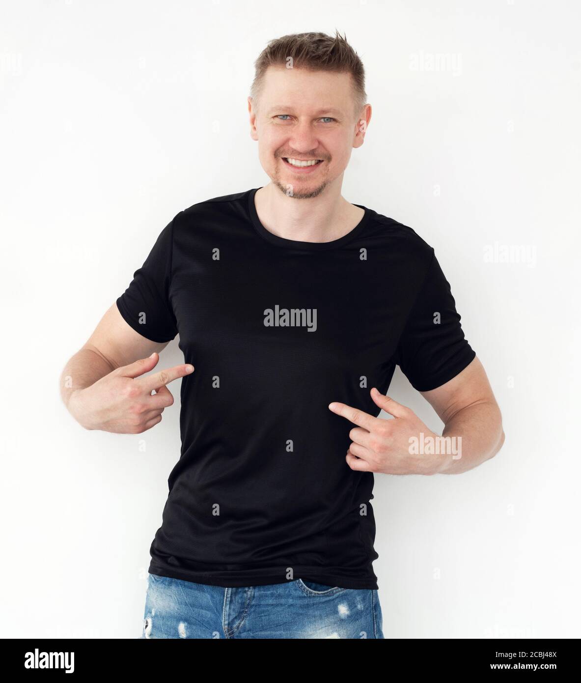 Attractive young man in a black T-shirt 