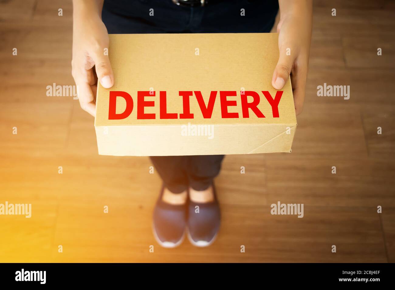 parcel package delivery from delivery man , anonymous face. Stock Photo