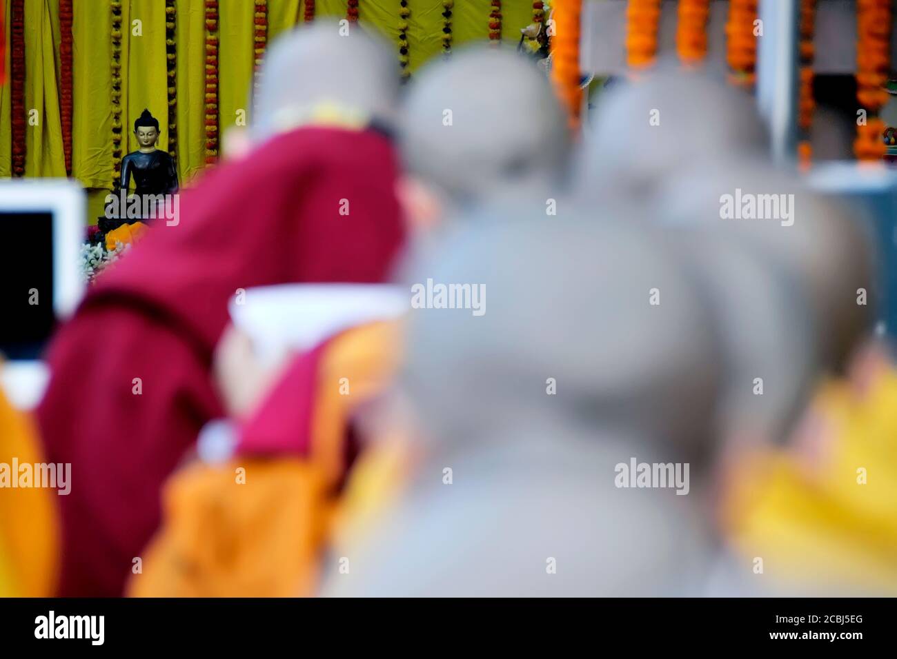 buddhist monks praying together at mahabodhi temple at bodh gaya bihar india during moonlam festival. Stock Photo