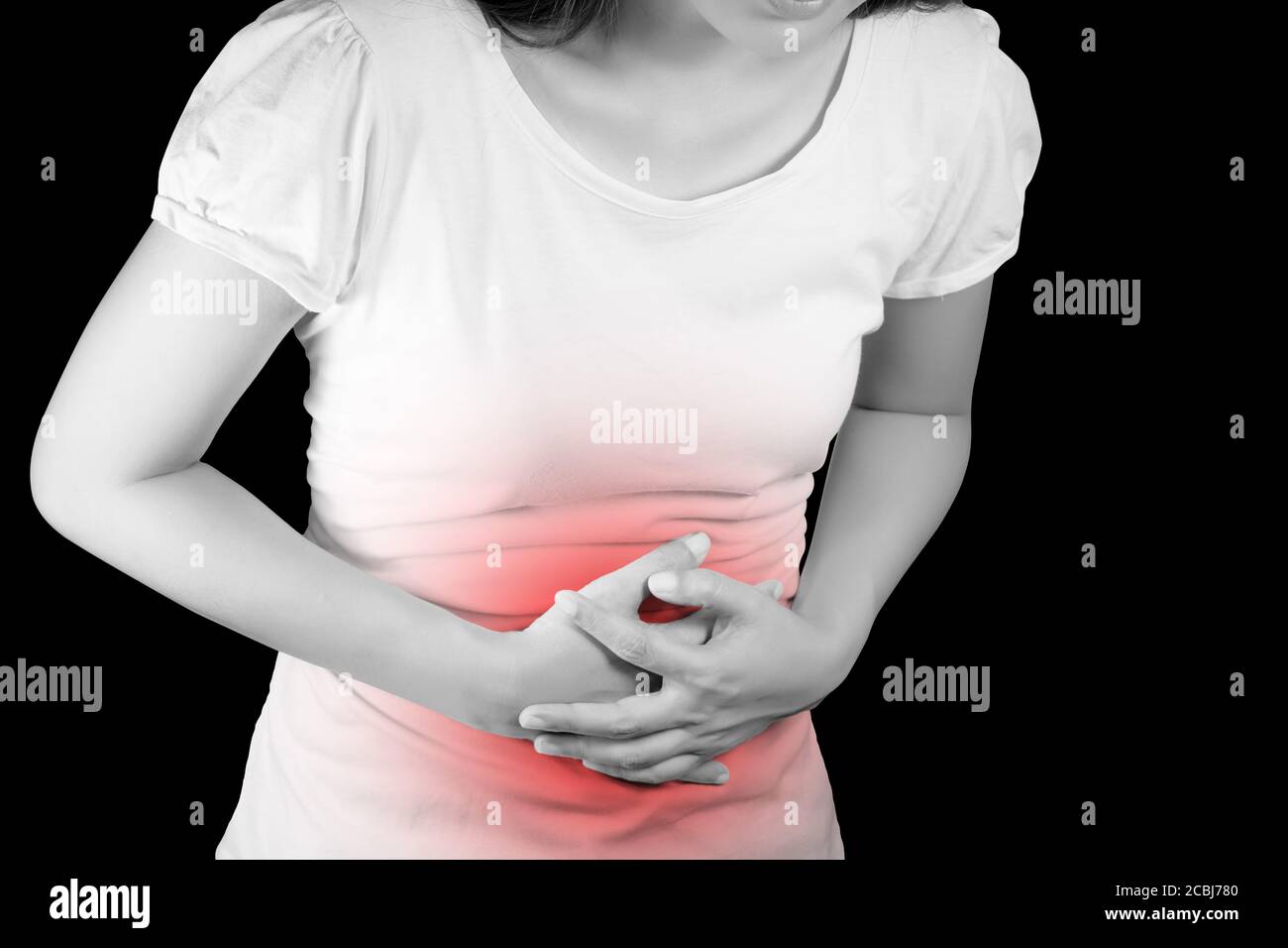 Woman suffer from stomachache or Gastroenterology. Concept with Healthcare And Medicine. Pain in red color. Isolate on black background with clipping Stock Photo