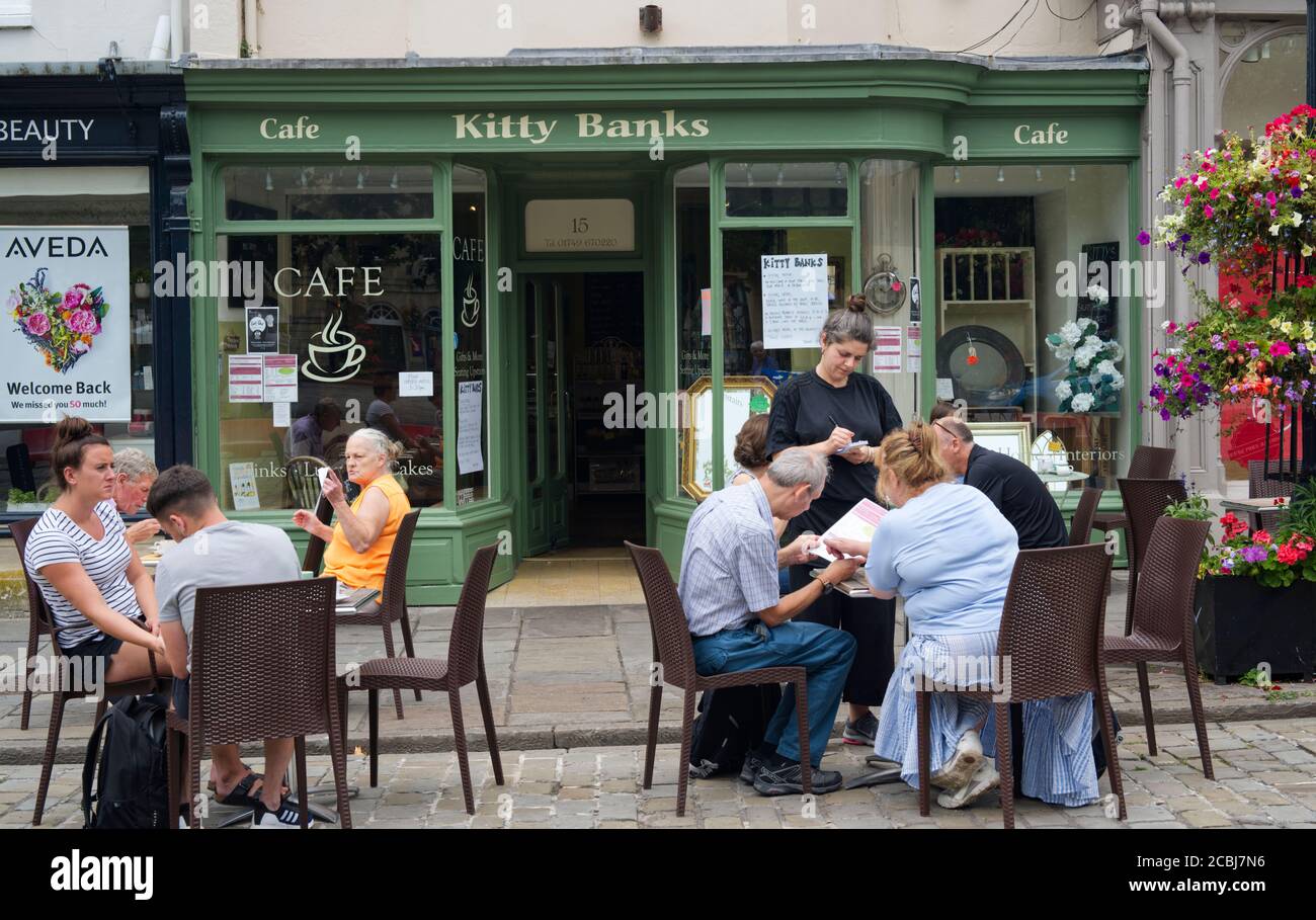Cafe at Wells Market square open and doing business as usual with social distancing. Stock Photo