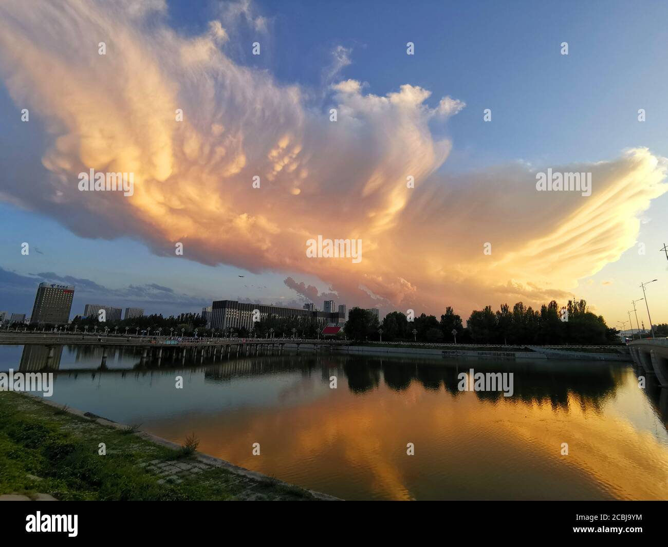 August 14, 2020, Huhehaote, Huhehaote, China: NeimemgguÃ¯Â¼Å’CHINA-The magic! On August 9, 2020, a qimei ''angel wings'' fire cloud was seen over Hohhot, Inner Mongolia. The curling clouds look like angels' wings, and many residents have been exposed to the sun and photographed the burning clouds, which shocked them. (Credit Image: © SIPA Asia via ZUMA Wire) Stock Photo