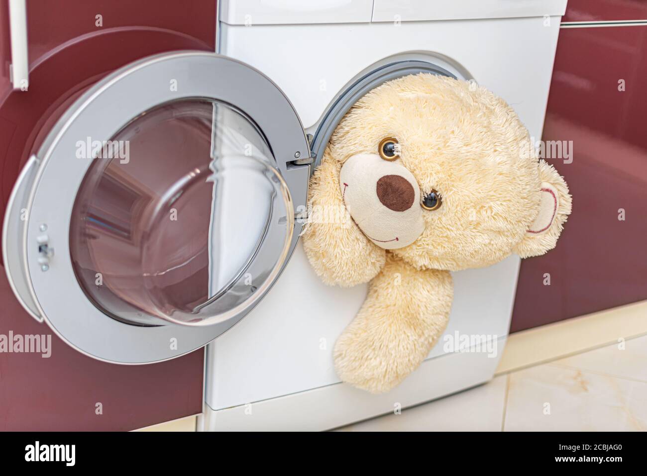 washing teddy bear in washing machine