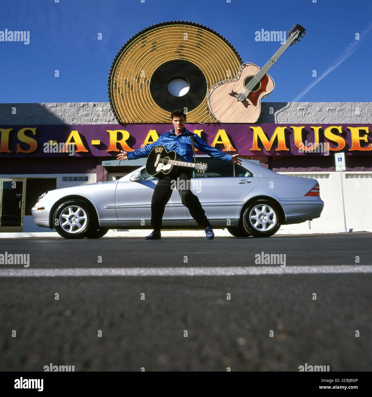Elvis inpersonator at the Elvis-A-Rama Museum in Las Vegas with Mercedes S500 automobile. 1998 Stock Photo