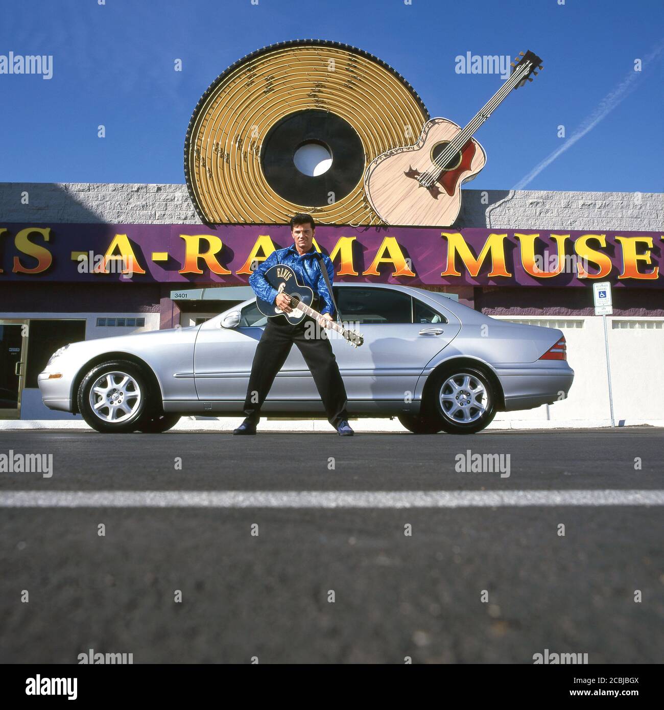 Elvis inpersonator at the Elvis-A-Rama Museum in Las Vegas with Mercedes S500 automobile. 1998 Stock Photo