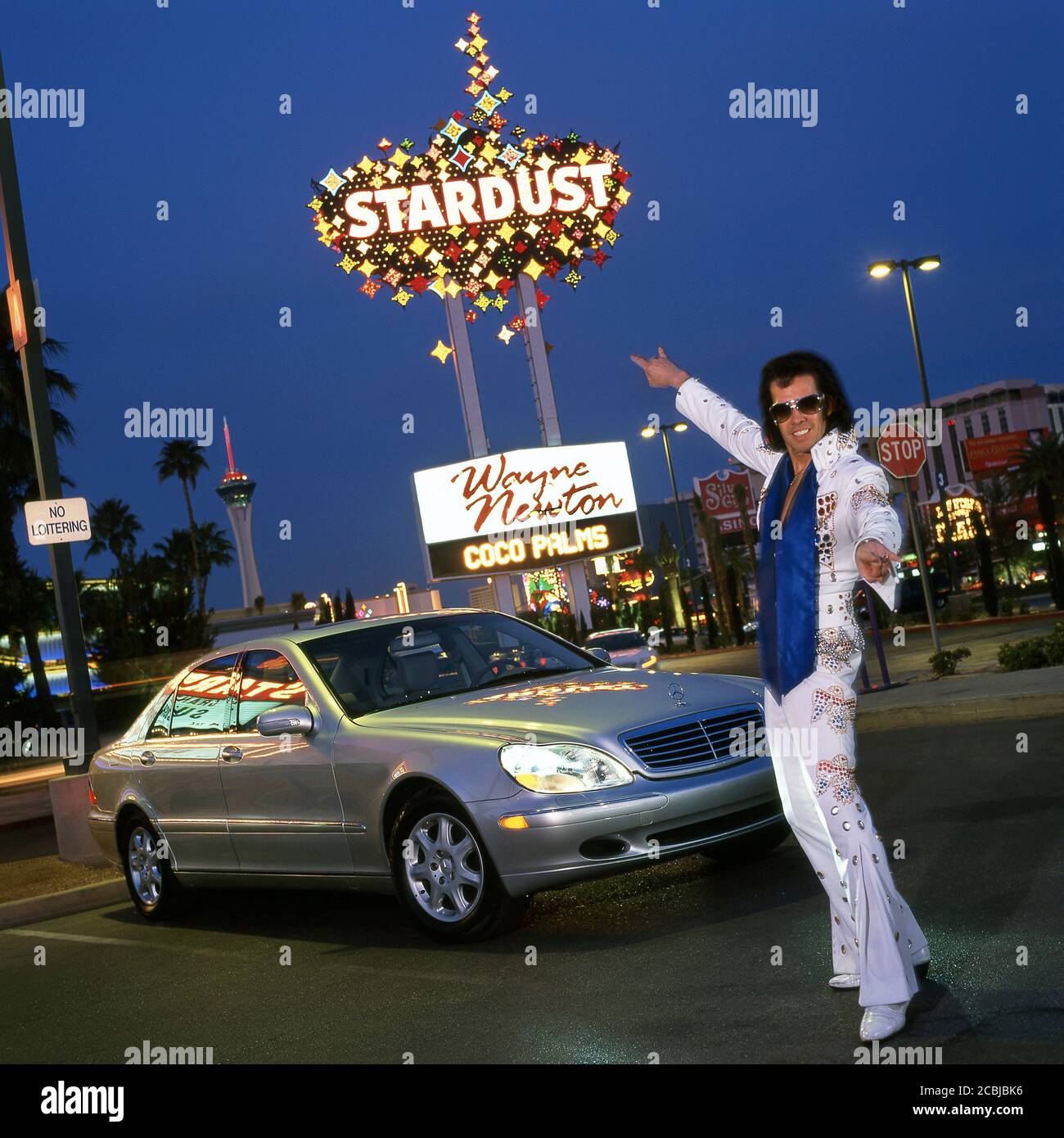 Elvis inpersonator in Las Vegas with Mercedes S500 automobile, at the Stardust Casino. 1998 Stock Photo