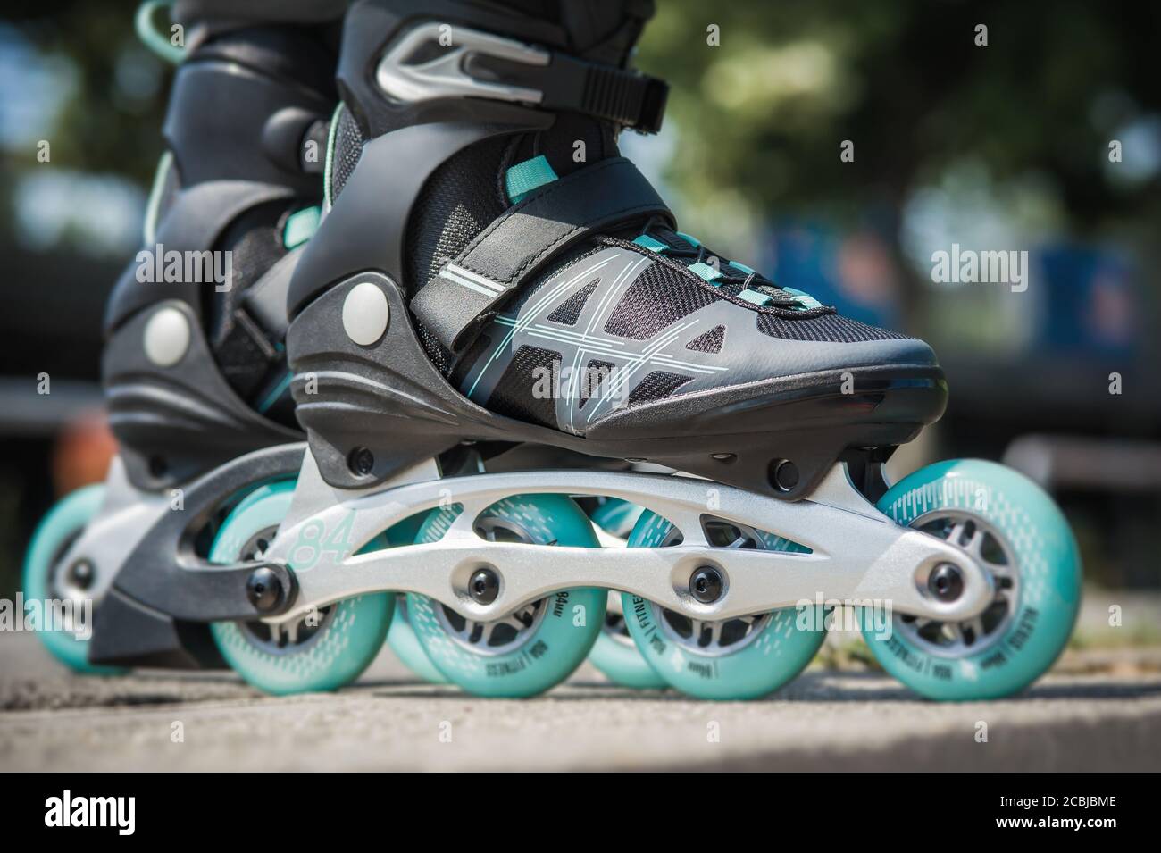 Retro cartoon style drawing of an athlete skater inline speed skating on  isolated background done in black and white Stock Photo - Alamy