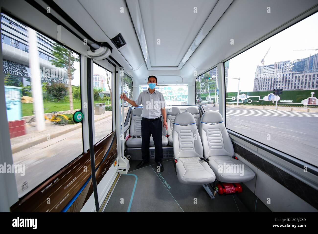 Zhengzhou, Zhengzhou, China. 14th Aug, 2020. HenanÃ¯Â¼Å'CHINA-On August 11, 2020, henan zhengzhou, zhengdong new district give wisdom island lake loop, yutong automated driving bus has run for a year, which is based on 5 g of L4 automated driving bus have highly intelligent, driven and autonomous obstacle avoidance, patrol intersection peers such as task can be accurate, complete, can also identify ambulances, fire engines, etc and take the initiative to give way.''Smart car   smart road   ubiquitous cloud'' is bringing great changes to zhengzhou citizens' travel. Despite being in operation Stock Photo