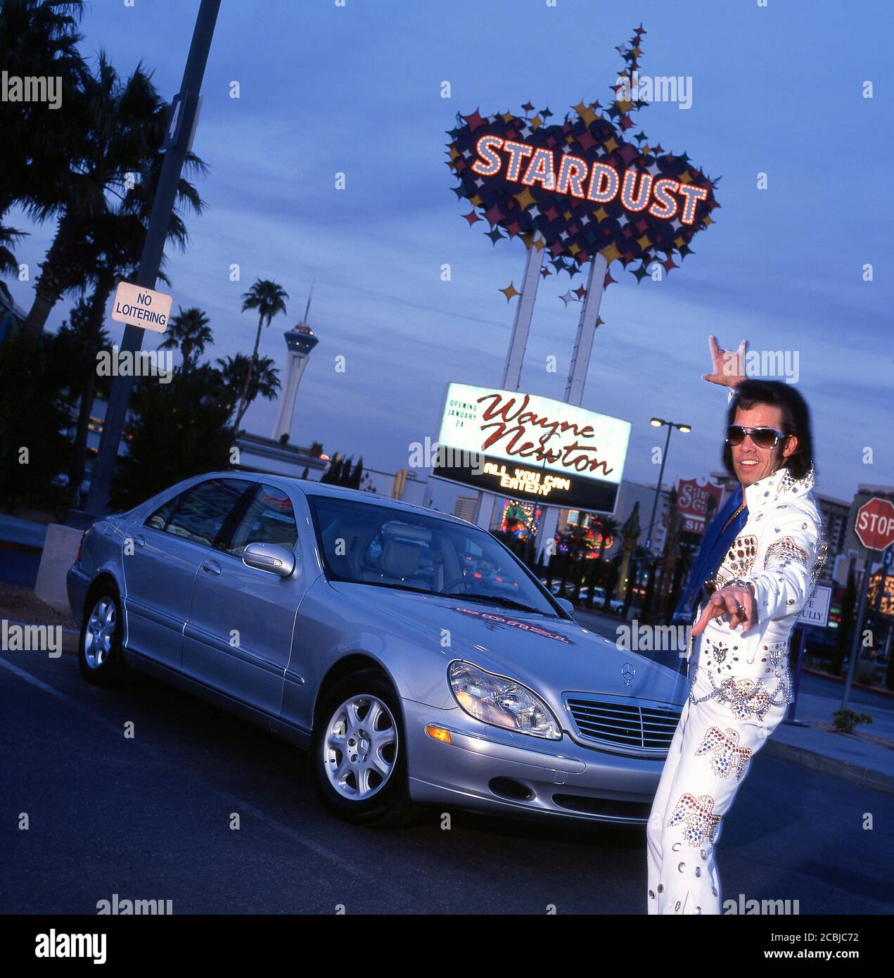 Elvis inpersonator in Las Vegas with Mercedes S500 automobile, at the Stardust Casino. 1998 Stock Photo