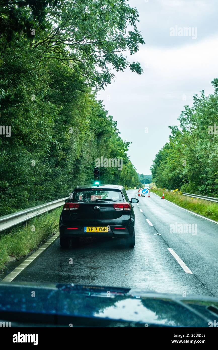 Drivers POV when stuck in roadworks traffic and green light Stock Photo