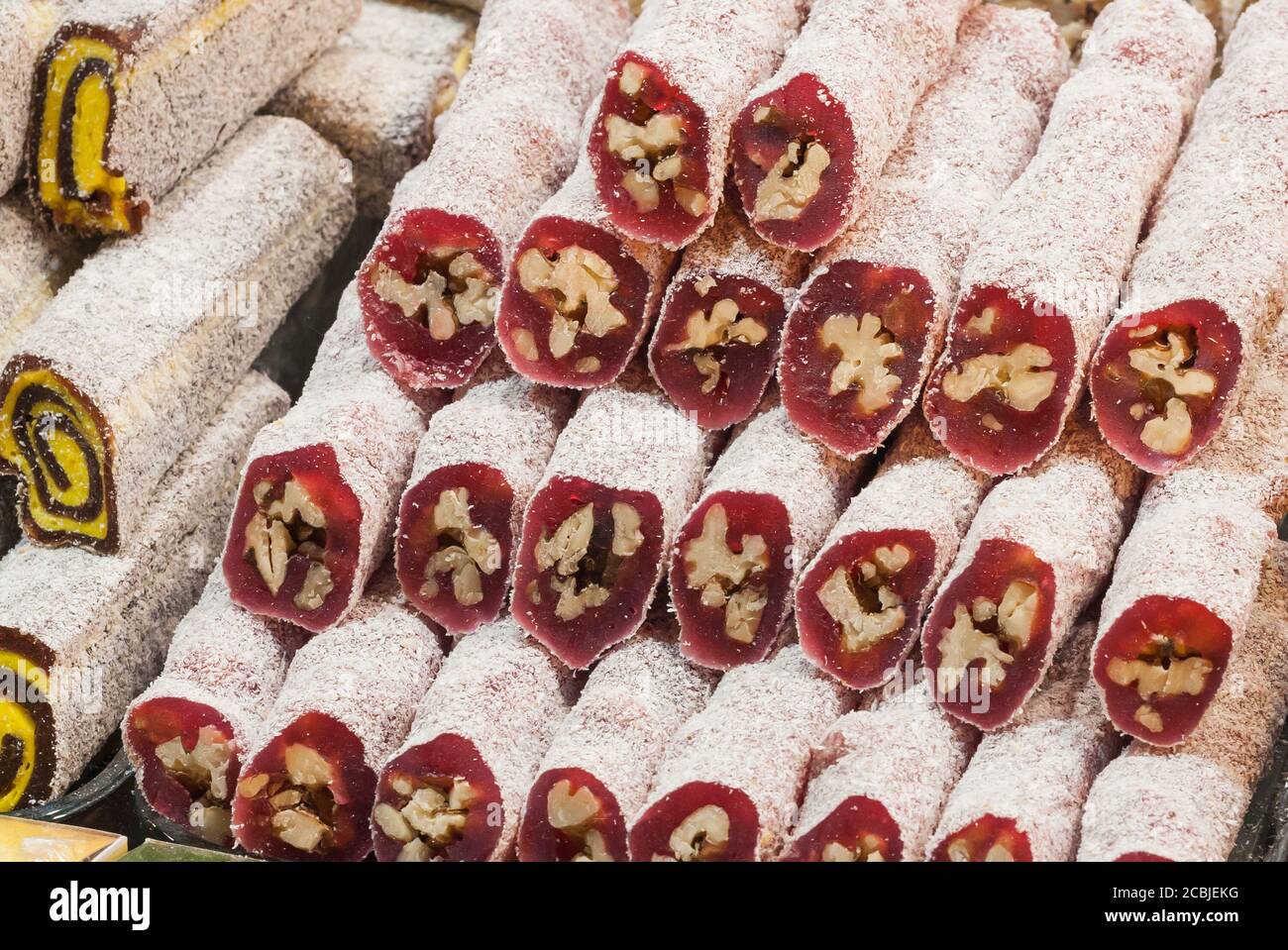 Colorful Turkish delight (lokum) rolls assortment for sale in a market in Istanbul. These are a specialty food in Turkey. Stock Photo