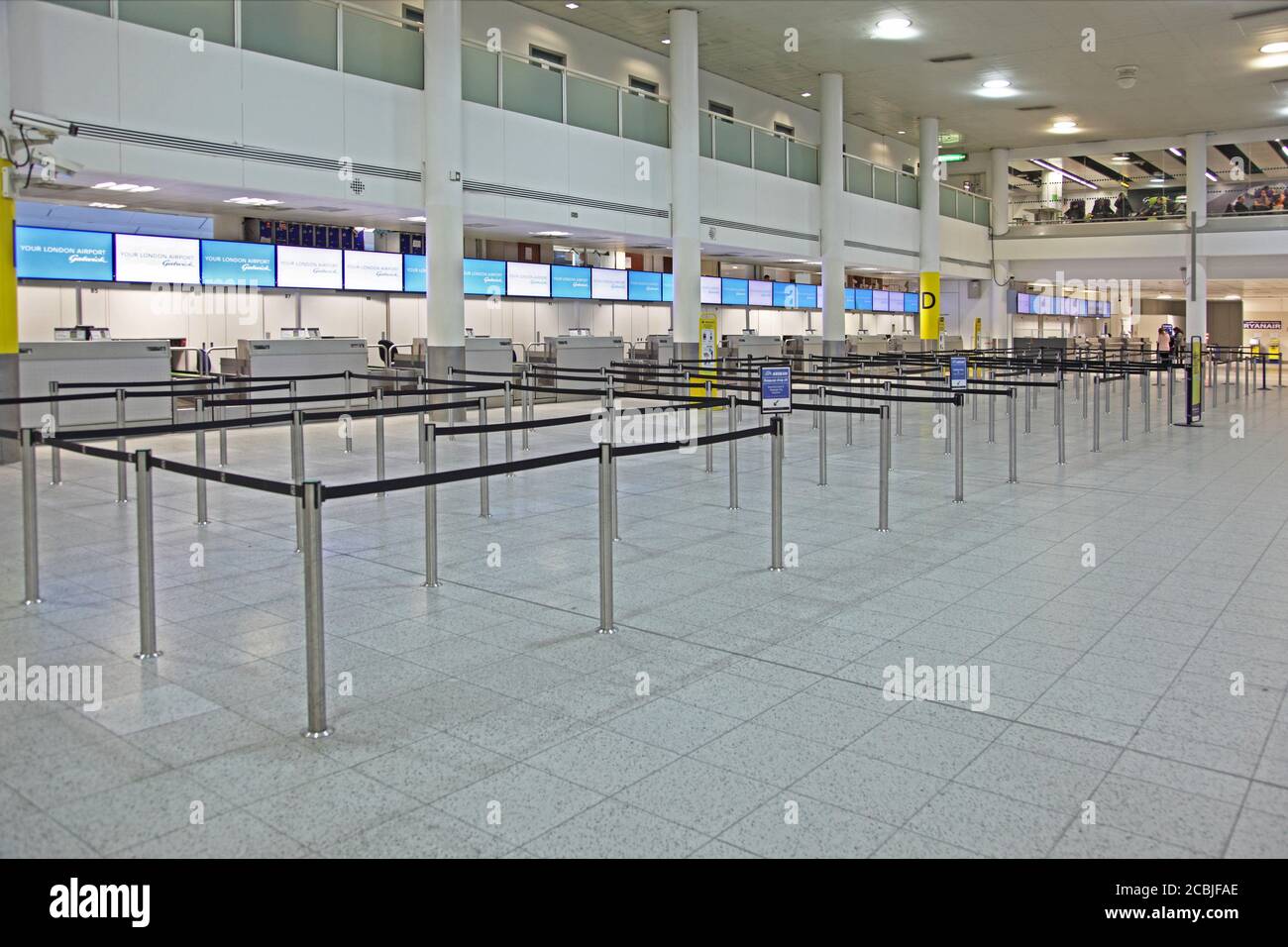 Deserted check-in desks at London's Gatwick Airport North Terminal, UK Stock Photo