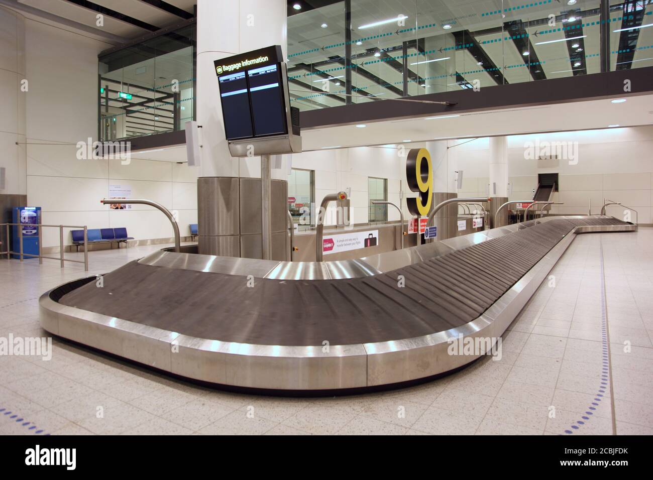 Deserted baggage reclaim hall at London's Gatwick Airport North Terminal, UK Stock Photo