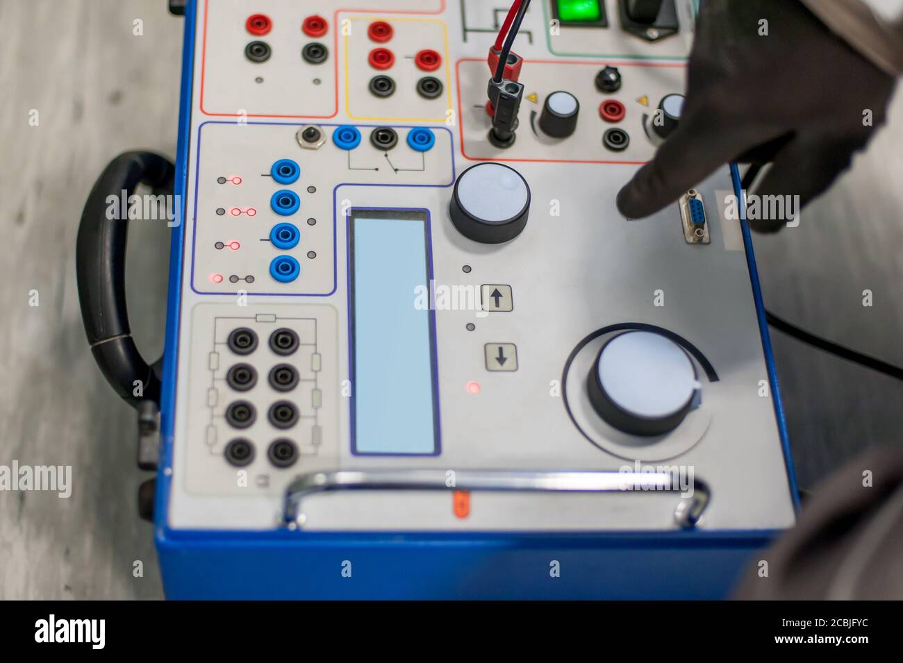 Maintenance engineer inspect system with relay test set equipment
