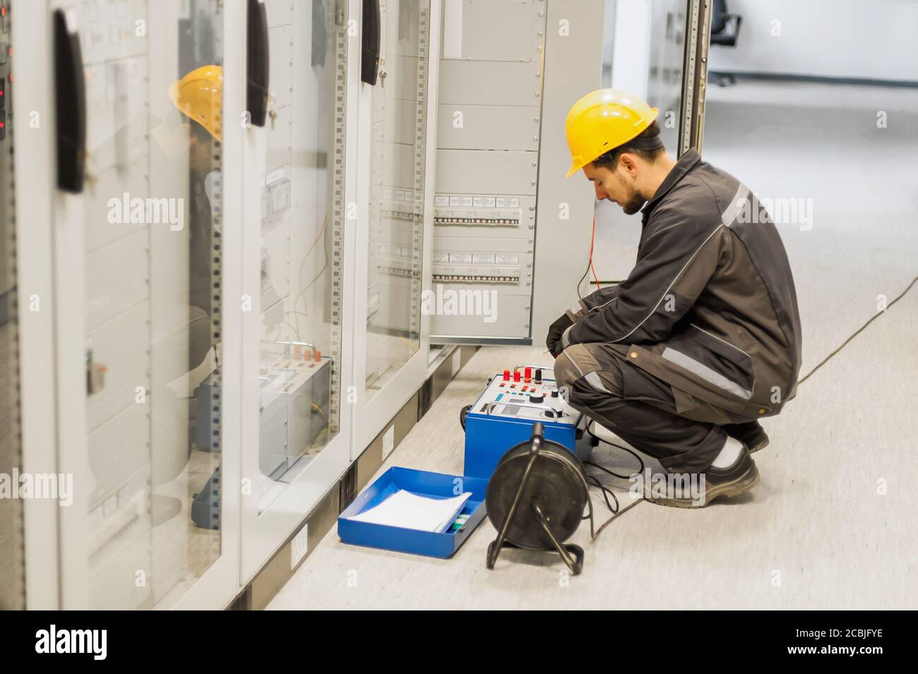 Maintenance engineer inspect system with relay test set equipment