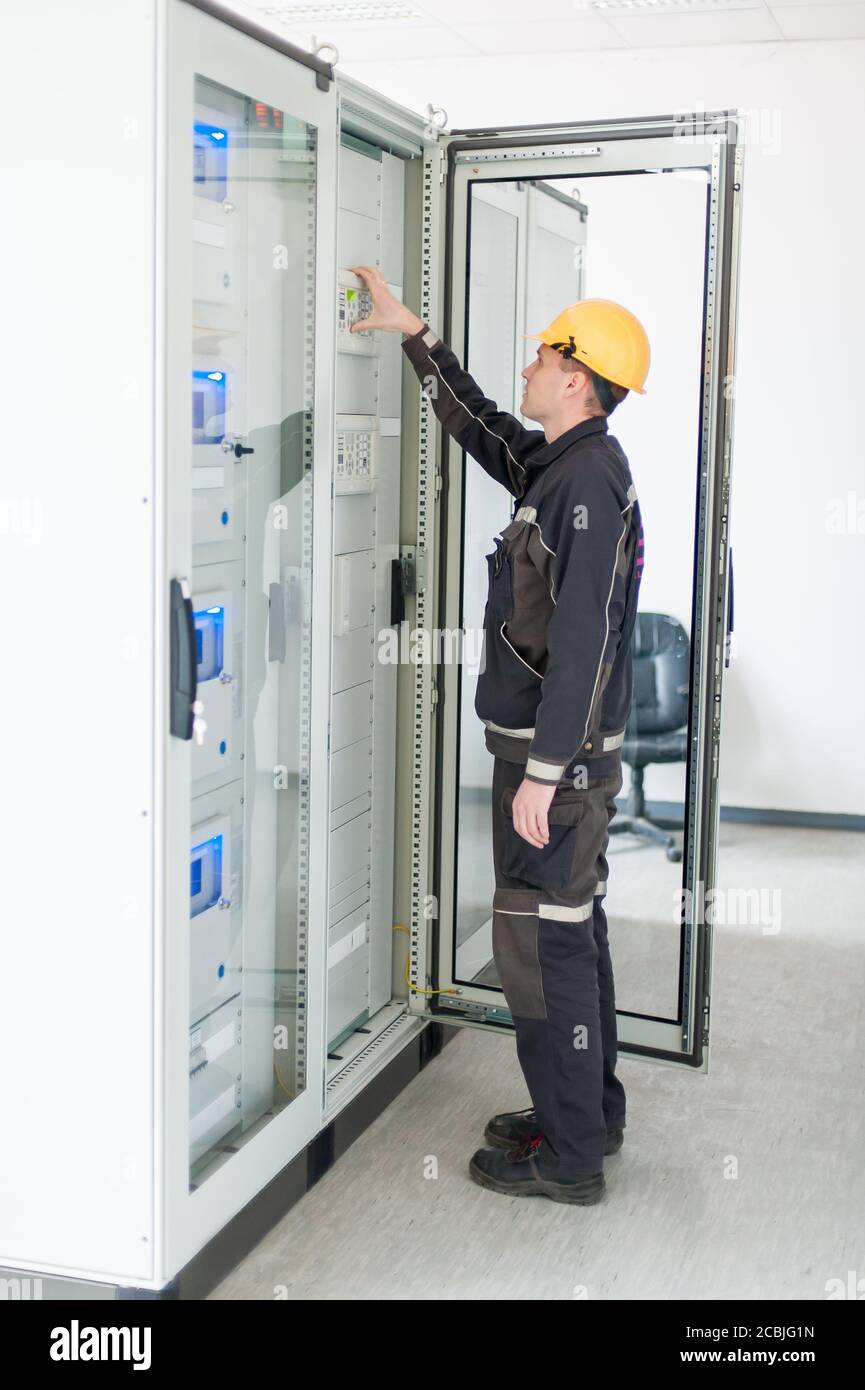 Maintenance engineer testing medium voltage switchgear and bay control