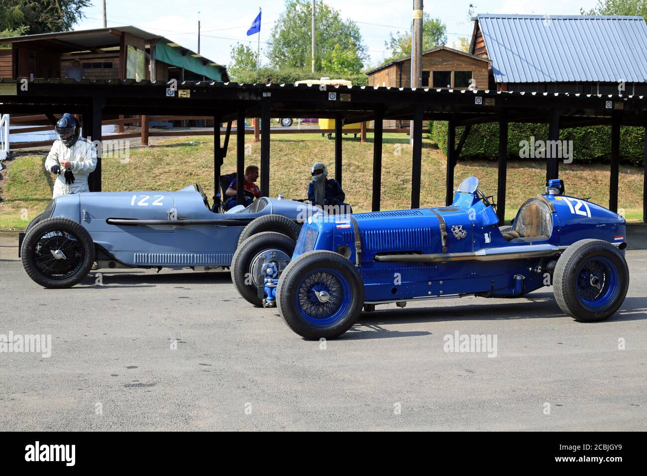 Mg Riley A 1935 MG Riley (lighter blue) and a 1937 ERA C-type parked together ...
