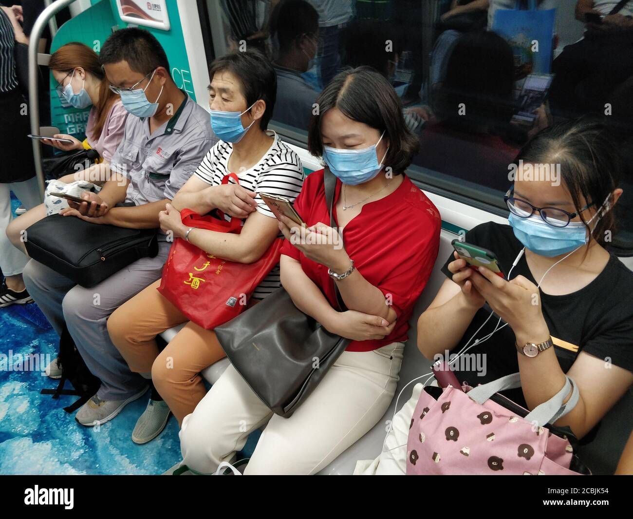 Hefei China 13th Aug 2020 People Wearing Face Masks As A Preventive Measure Look At Their Smartphones On The Subway In China Tencent S Wechat Bytedance S Tiktok Alibaba S Taobao Alipay And Baidu S Iqiyi