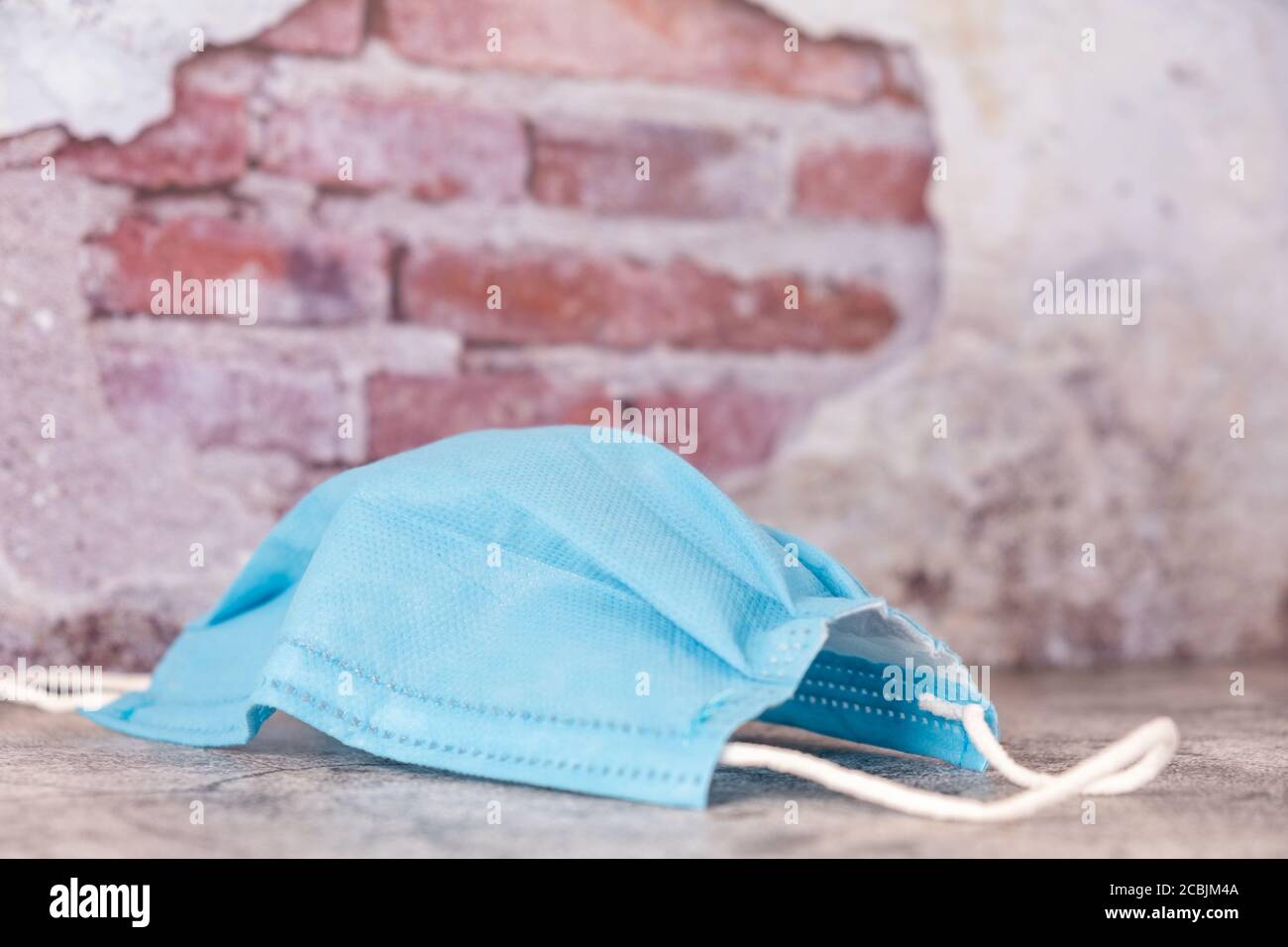 Picture of medical mask thrown on the ground during coronavirus ...