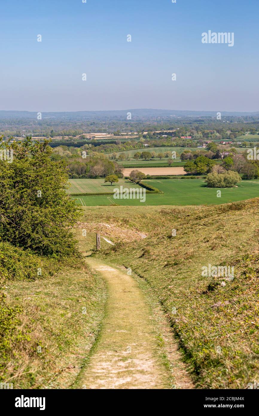 Looking along a pathway towards farmland, on Malling Down in Lewes Stock Photo