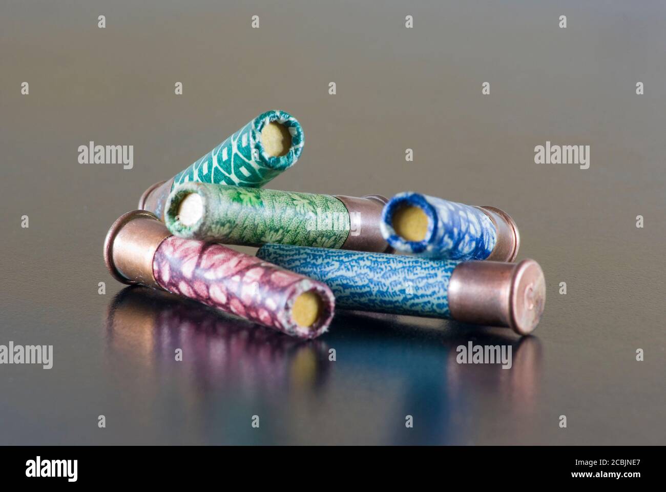 Heap of hunting cartridges of different colors. Stock Photo