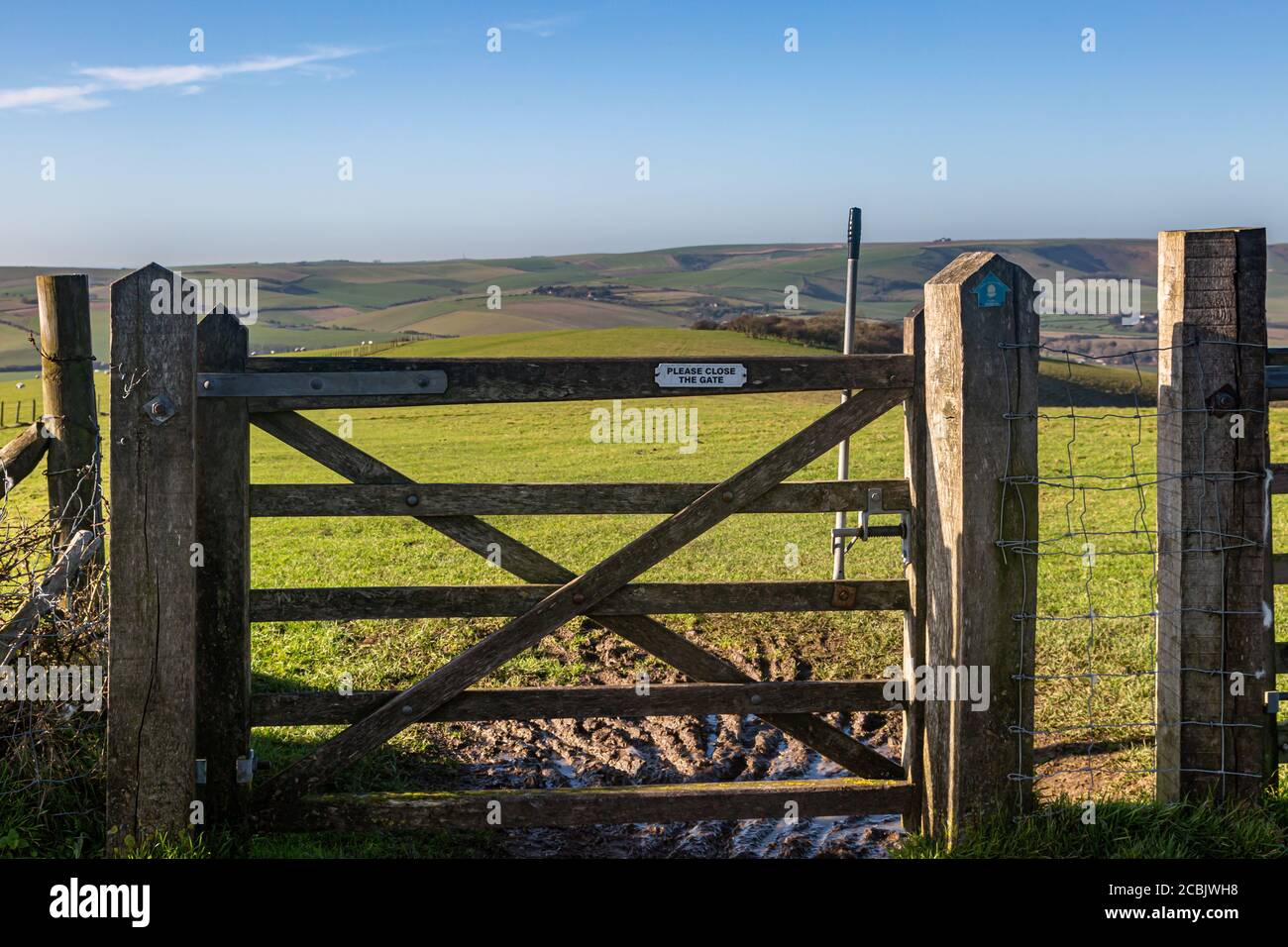 A wooden gate along the South Downs Way, on Firle Beacon in Sussex Stock Photo