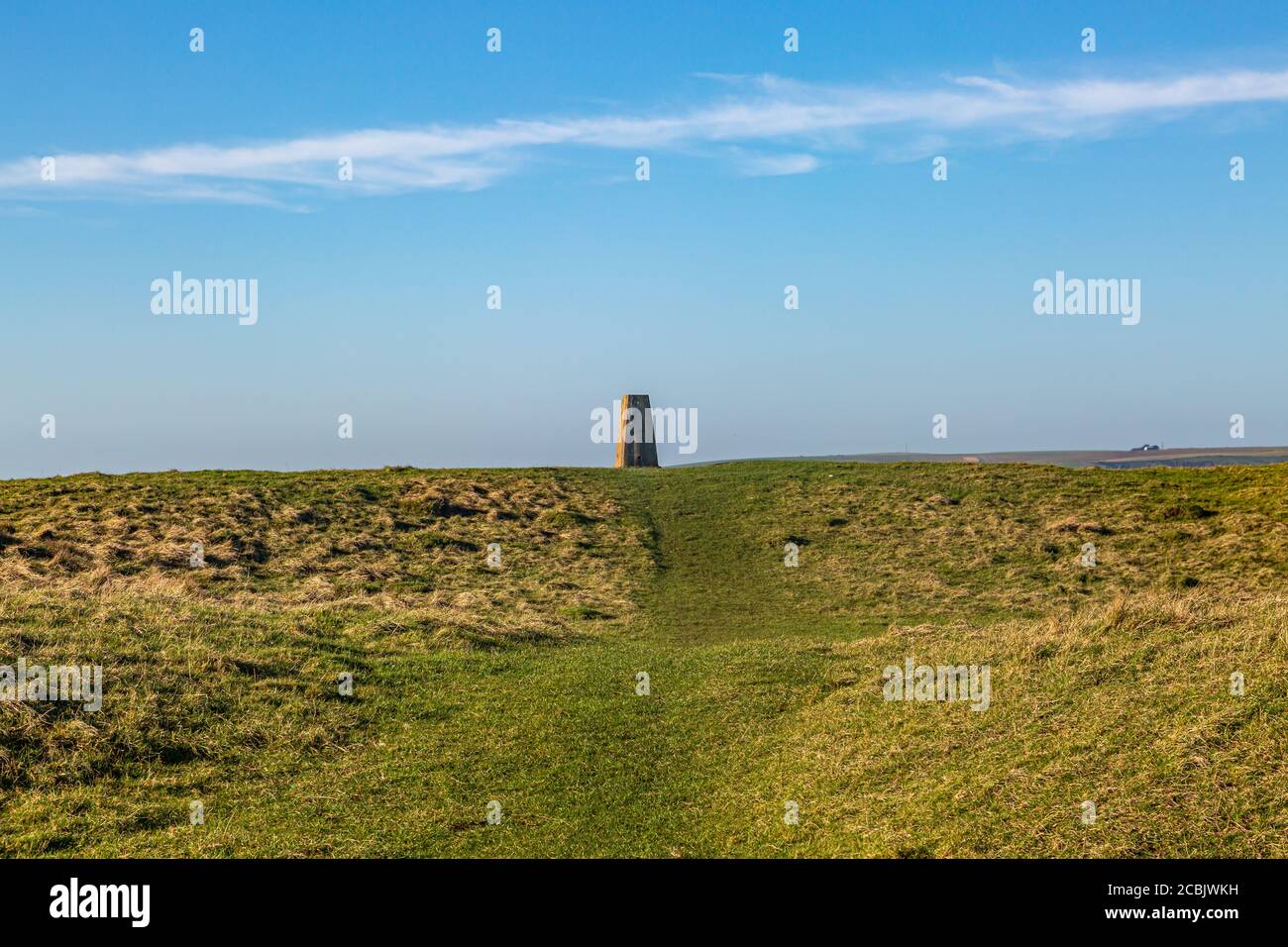 A trig point on Firle Beacon in the South Downs, on a sunny winters day Stock Photo